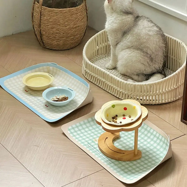 Waterproof non-slip PawHappiness pet feeding mat with raised edges holding food and water bowls for dogs and cats