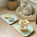 Waterproof non-slip PawHappiness pet feeding mat with raised edges holding food and water bowls for dogs and cats